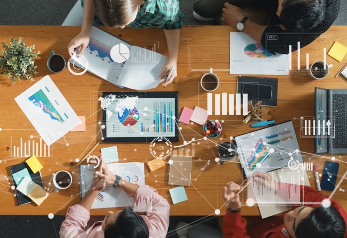 top-view-business-people-working-analyzing-investment-data-convocation